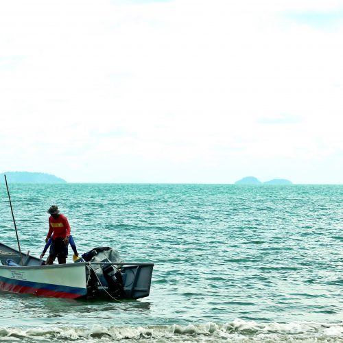 Quiet beach in Malaysia - fisherman of Telok Serbang