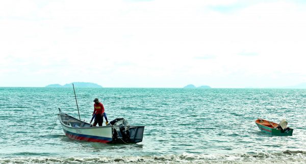 Quiet beach in Malaysia - fisherman of Telok Serabang