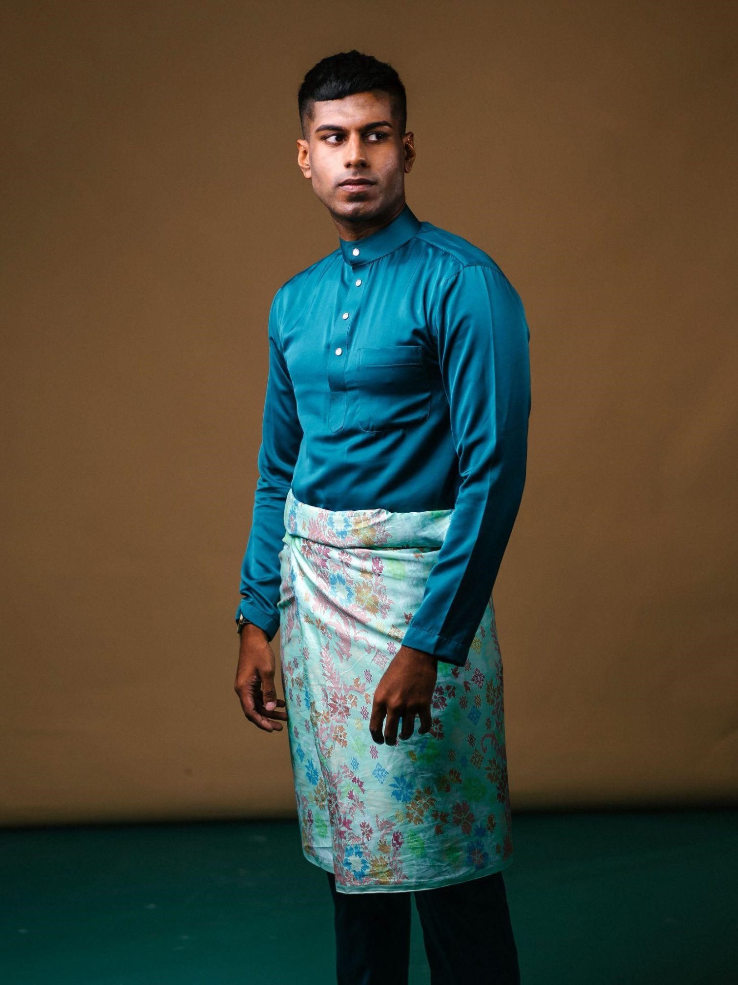 A baju Melayu with songket.